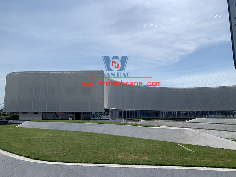 PTFE mesh membrane structure project on the facade of a new factory building PTFE mesh membrane structure project on the facade of a new factory building