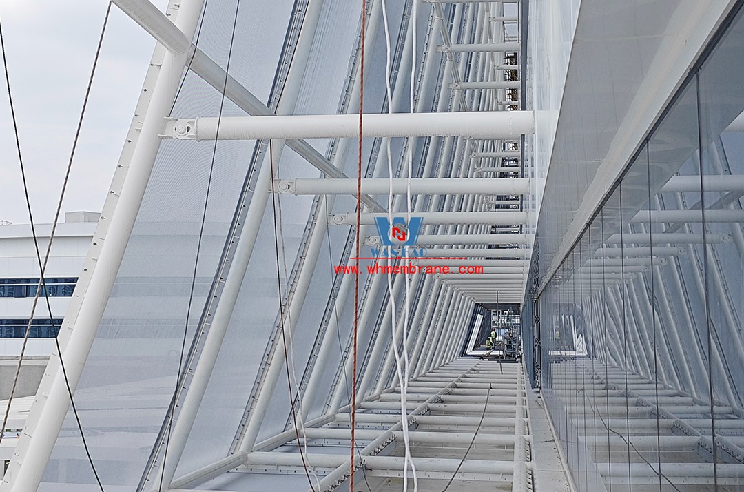 Focusing on high-quality construction, this mesh fabric curtain wall is under construction and installation